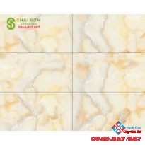 Gạch trung quốc cao cấp 40x80 vân đá vàng dán vách nhà phố đẹp