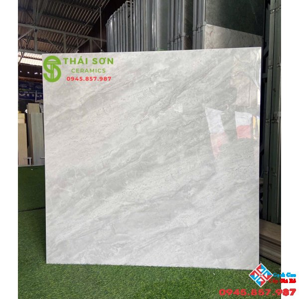 Gạch cmc 100x100 bóng kiếng lát nền phòng khách vân đá